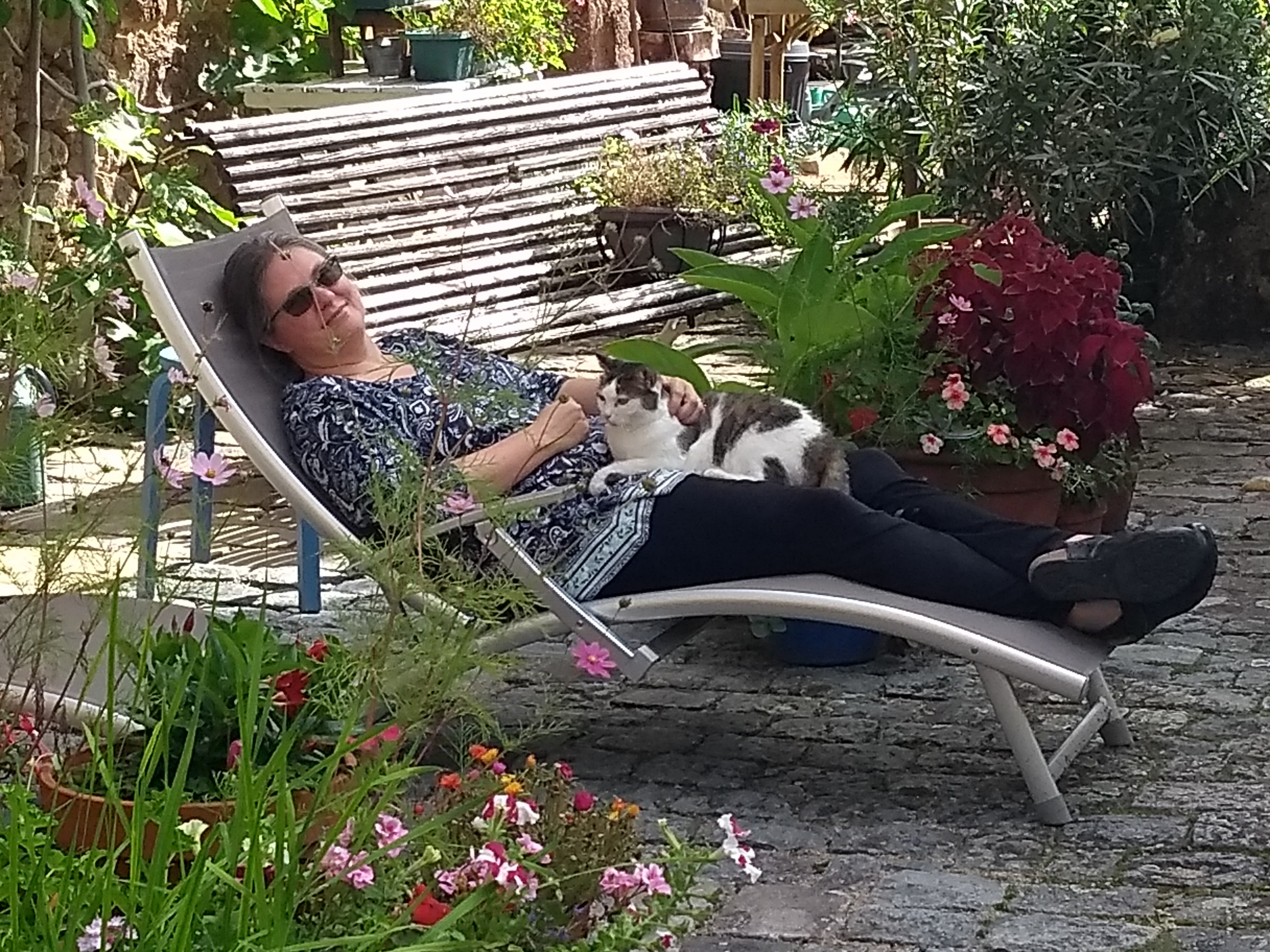 Melissa in a lawn chair with a cat on her lap