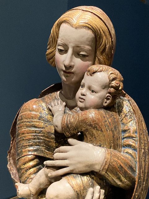 Carving in painted wood of a tender, natural-looking Madonna and Child