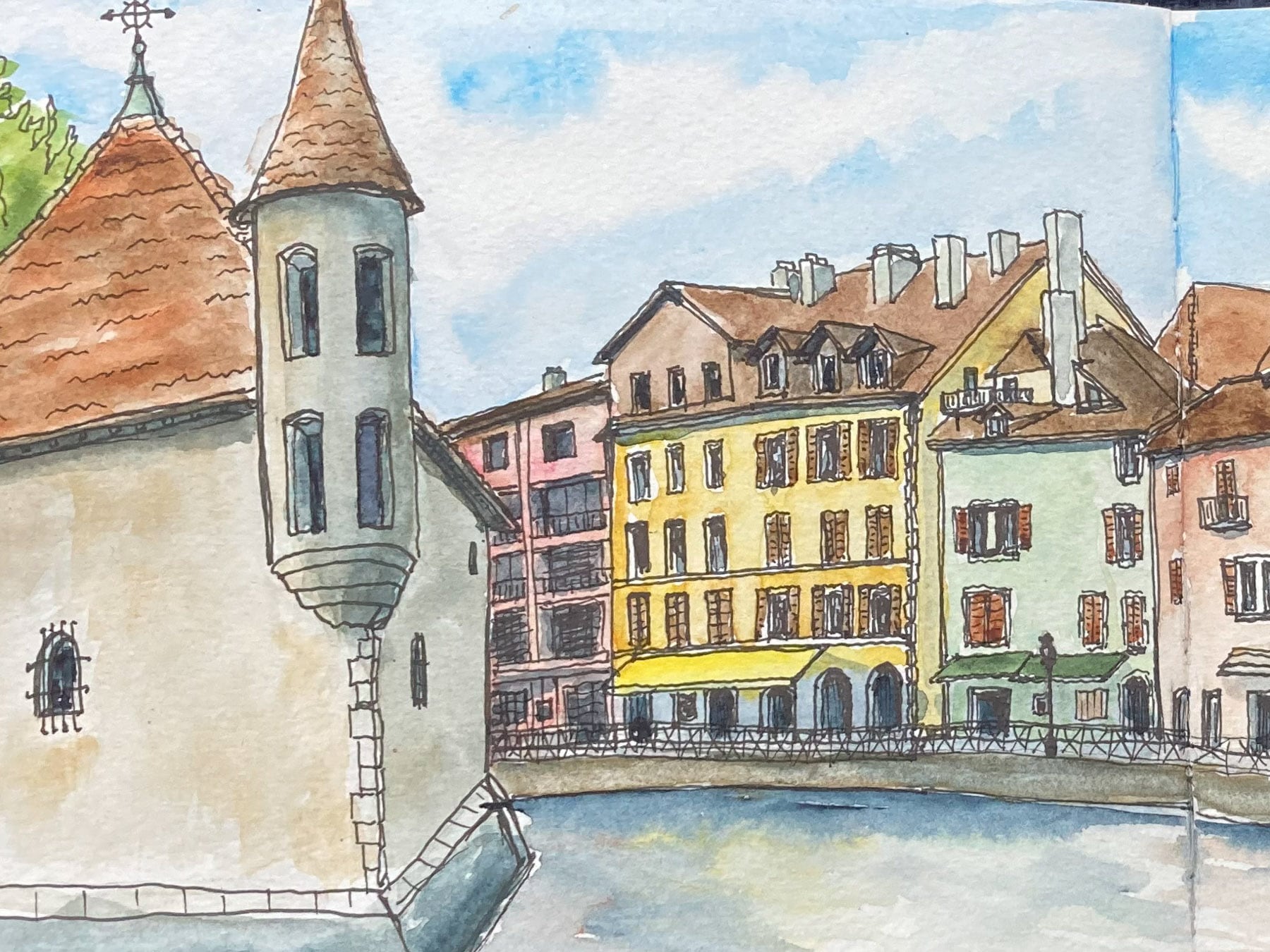 Watercolor painting of old buildings on the river in Annecy