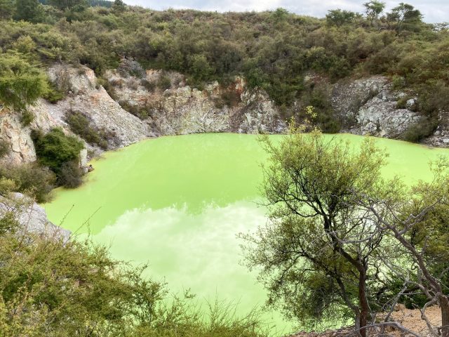 Pond of unearthly light green water, like the color of antifreeze