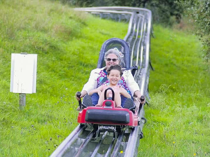 Melissa and Naomi riding a rodelbahn near the Open-Air Museum